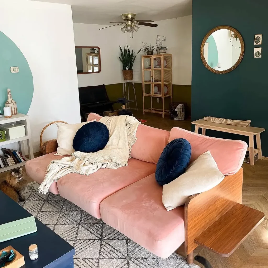 Pink Velvet Couch with Bold Black Accents